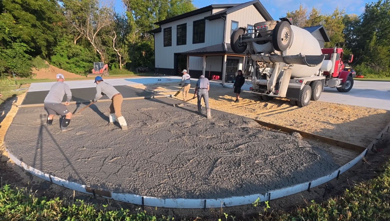 Professional concrete contractor pouring driveway in Owasso, OK